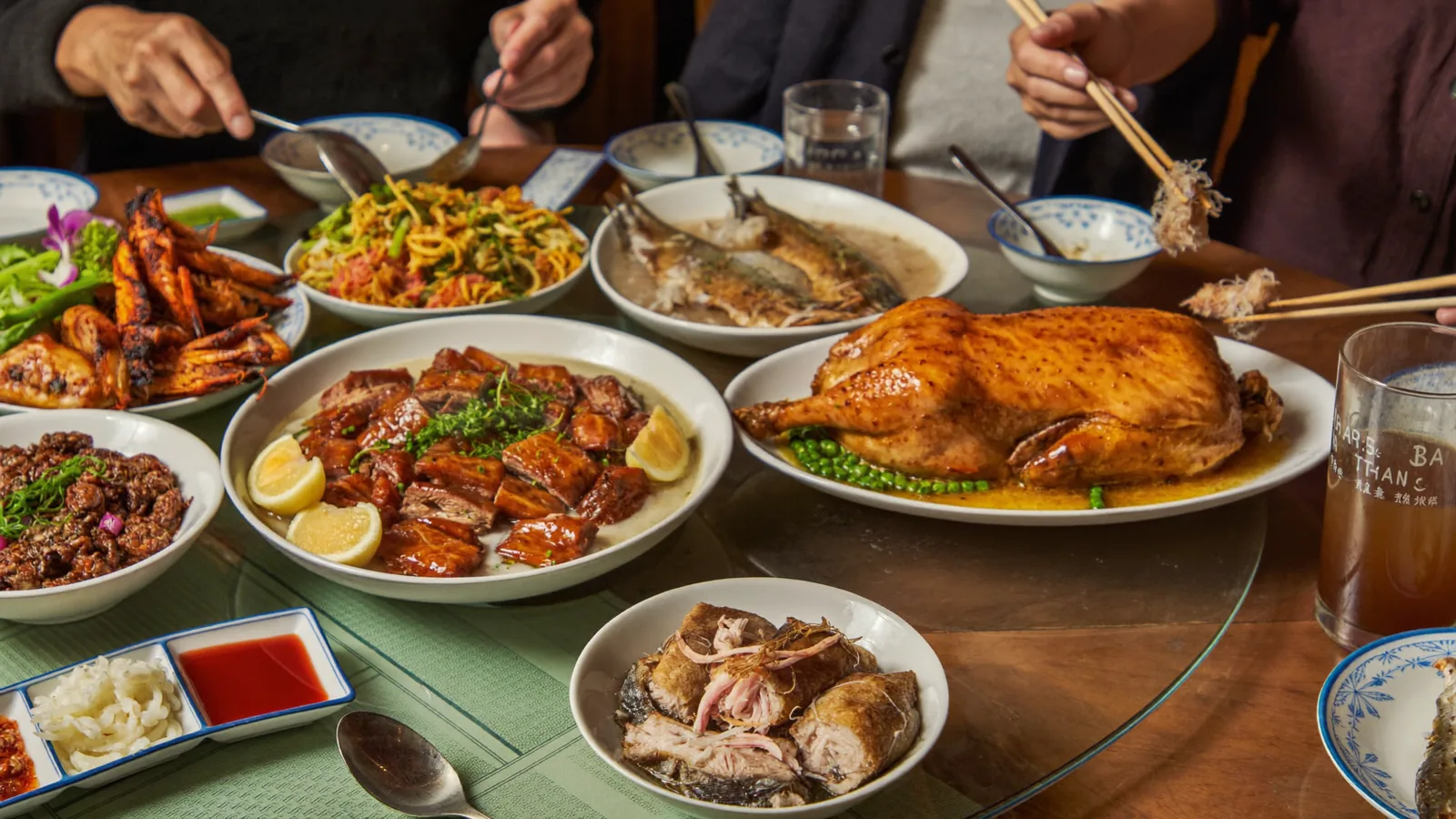 A spread of Cantonese roast meats and dishes - an illustrative hero for this Hong Kong roast goose and siu mei guide, not a photo of the shops featured