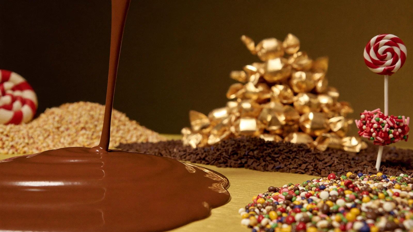 A theatrical stage bathed in golden light with oversized candy-cane and chocolate-factory set pieces, illustrating the Hong Kong debut of Charlie and the Chocolate Factory: The Musical - an illustrative image, not a photo from the actual production
