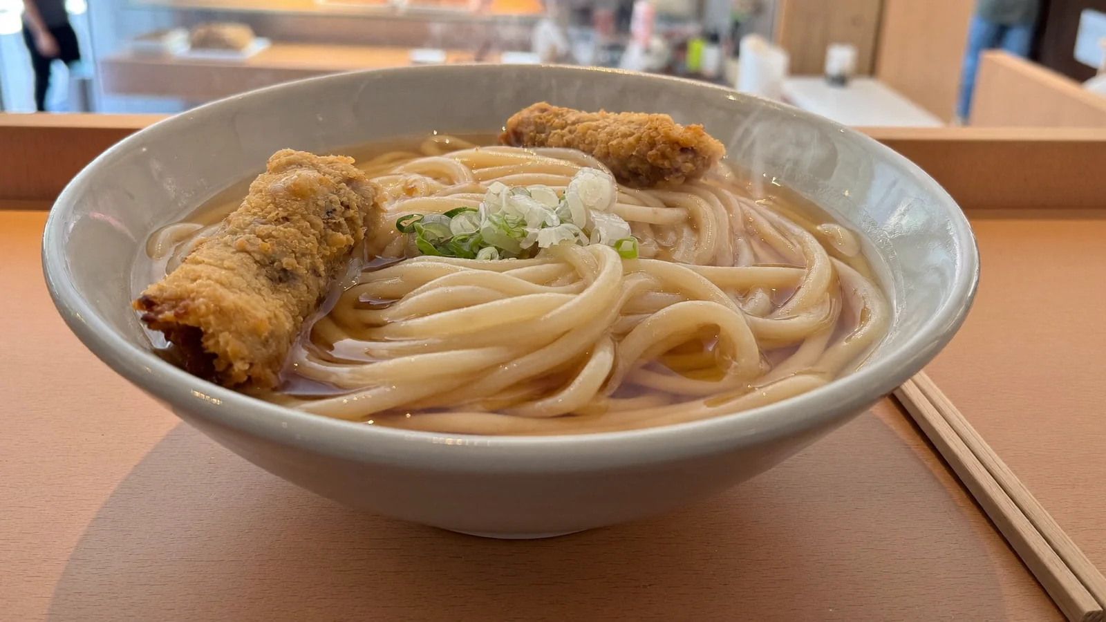 A bowl of Japanese noodles in broth, illustrating Daichi no Udon's Fukuoka-style udon at Olympian City, Tai Kok Tsui