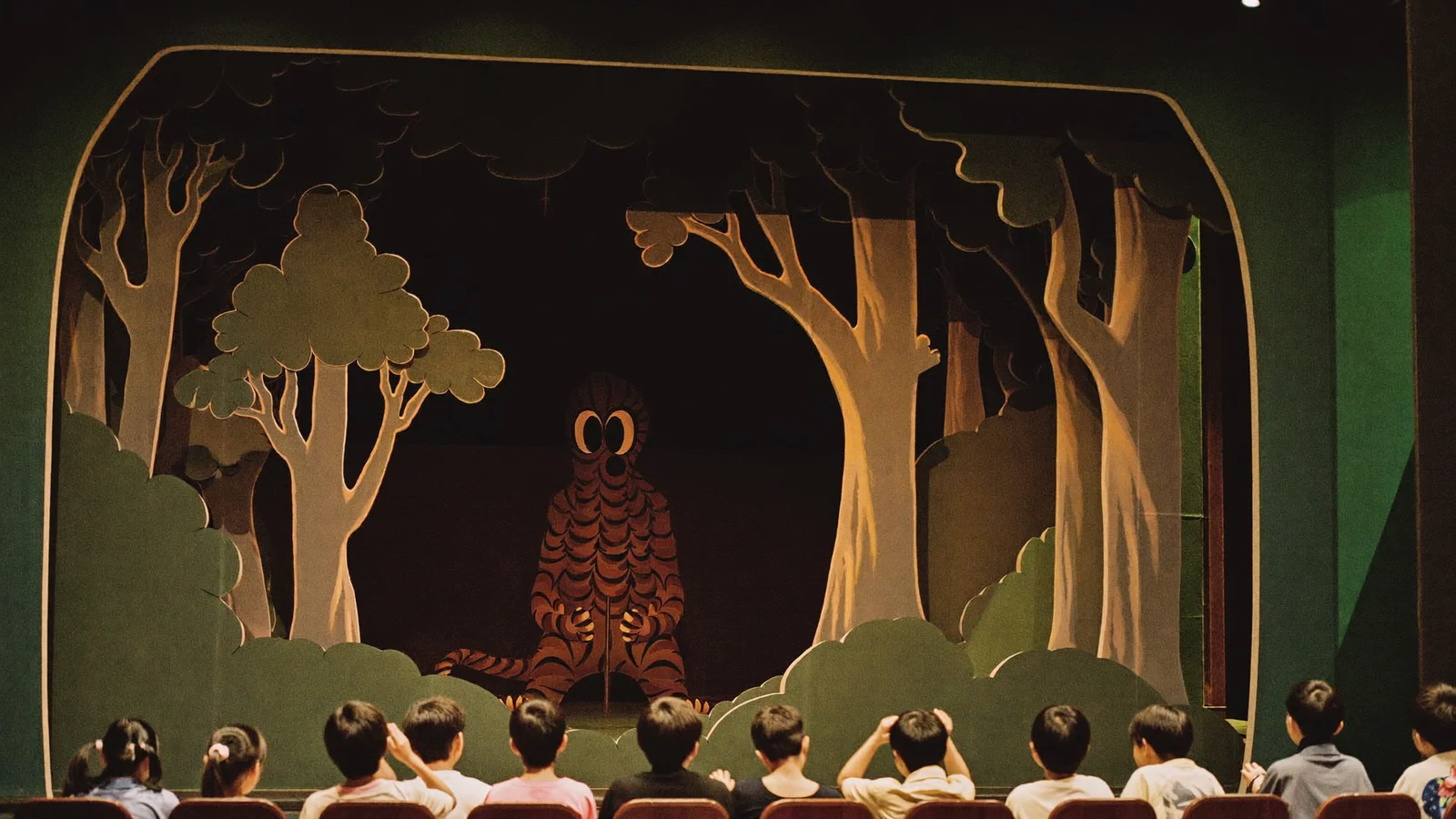 A warmly lit children's theatre stage set inside a deep, dark storybook forest with soft woodland silhouettes - an illustrative hero image for this Gruffalo Hong Kong guide, not a photo of the actual production
