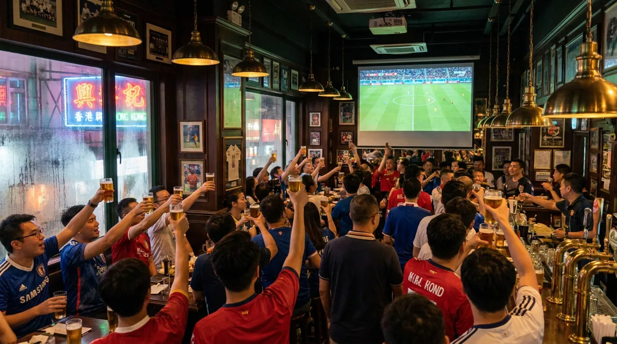Crowd of football fans watching a match on a big screen in a Hong Kong sports pub with raised pints